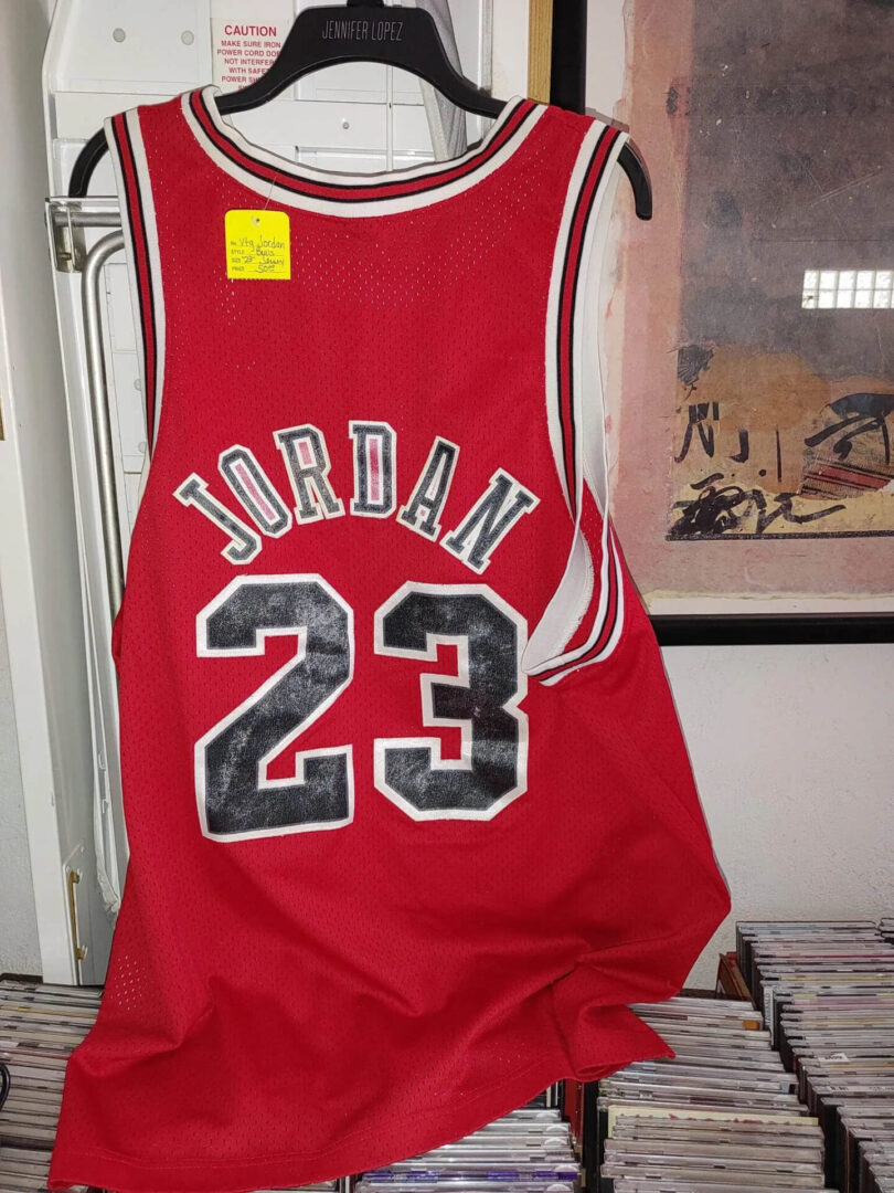A red basketball jersey with the number 2 3 on it.