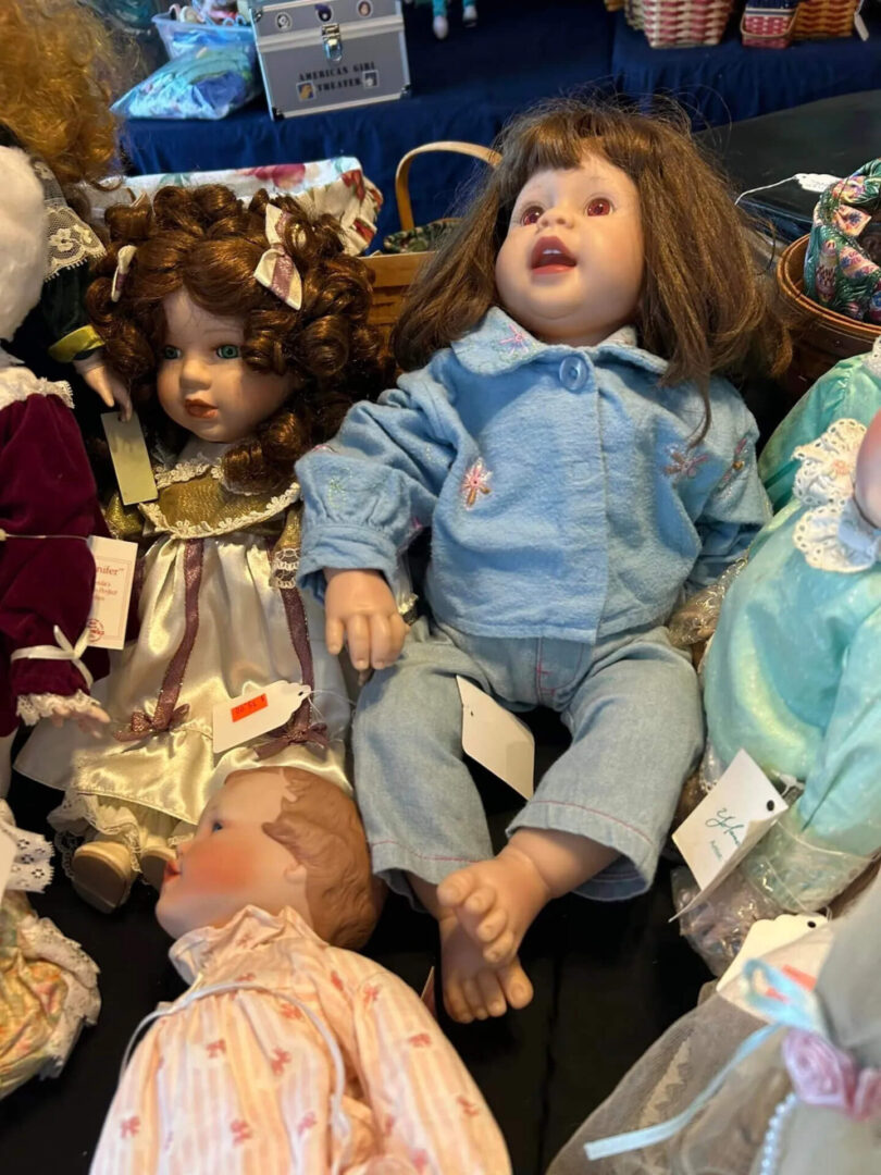 A group of dolls laying on top of each other.